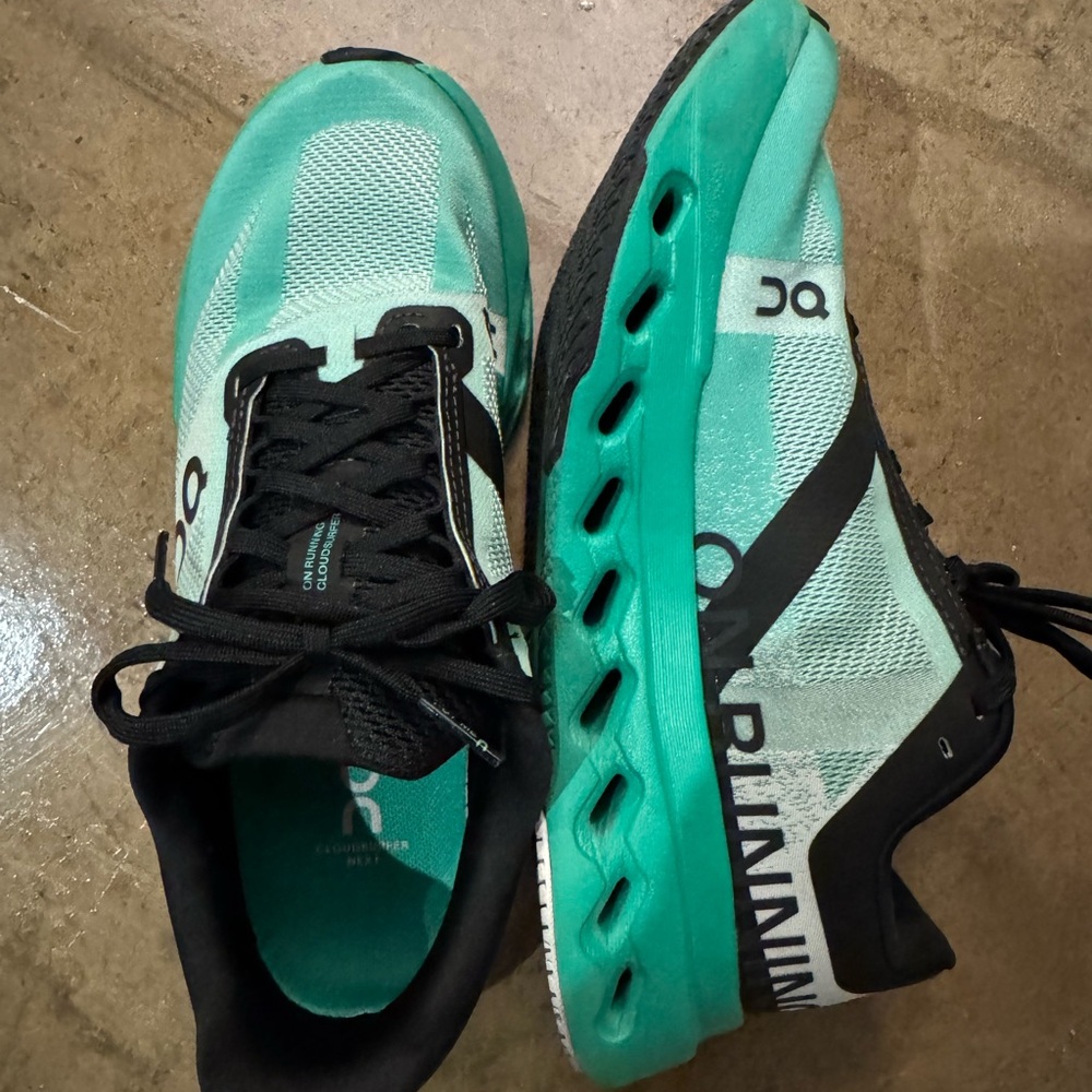 On Running Shoes with Teal and Black Accents